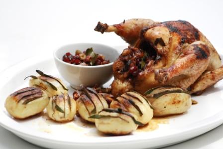 ROAST CHICKEN STUFFED WITH SPICED PISTACHIO NUTS AND CRANBERRIES.